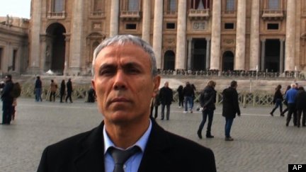 Man Who Attempted To Kill Pope John Paul II Places Roses On His Grave