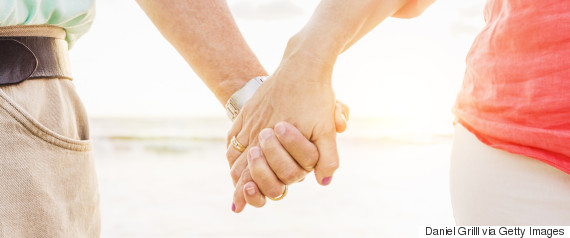 mature couple holding hands