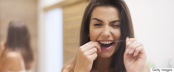 woman flossing