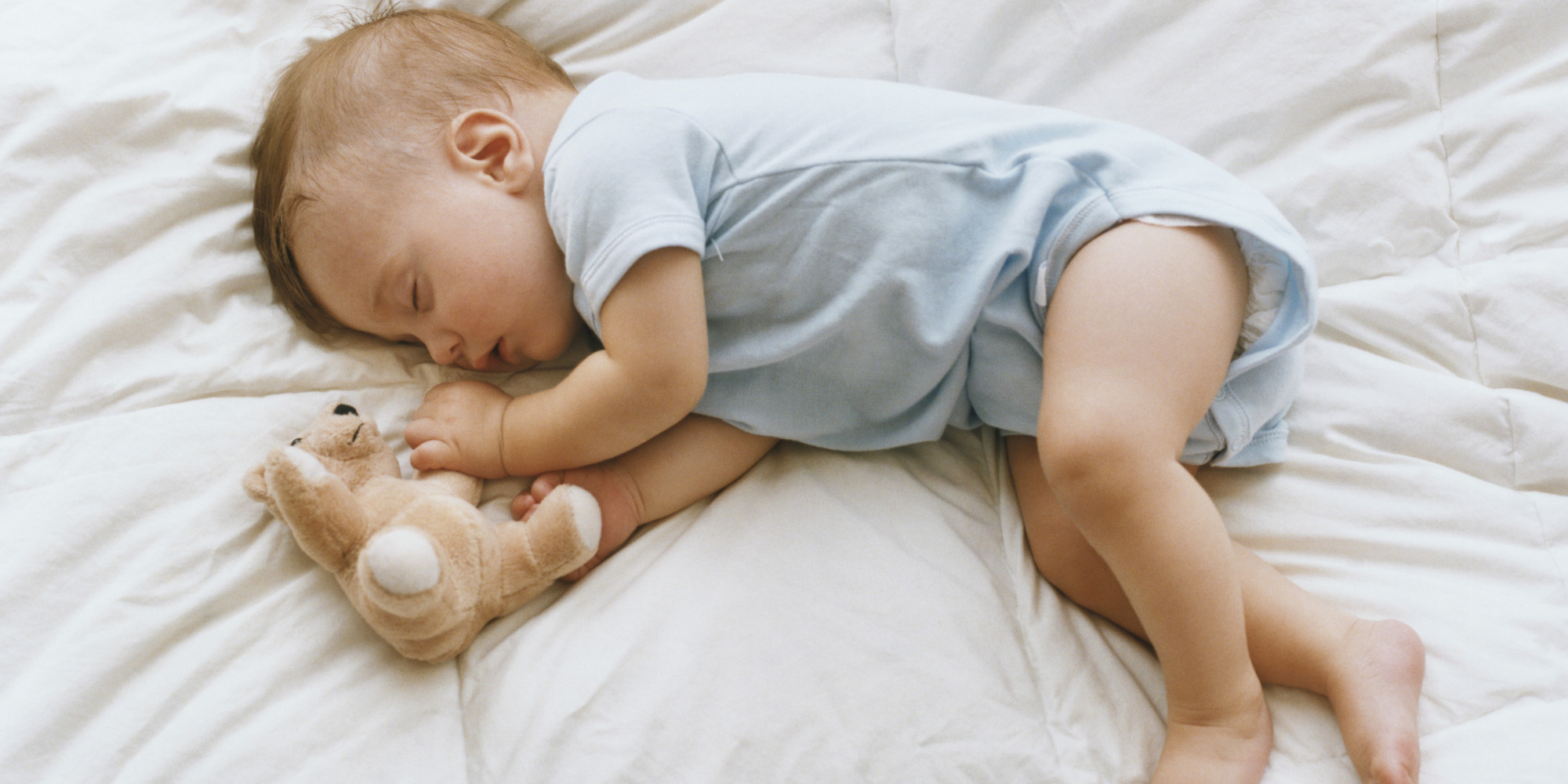 infant sleeping on floor mattress