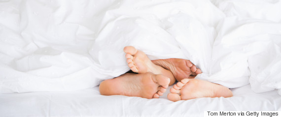 woman feet bed