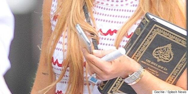 Lindsay Lohan Photographed Carrying A Quran