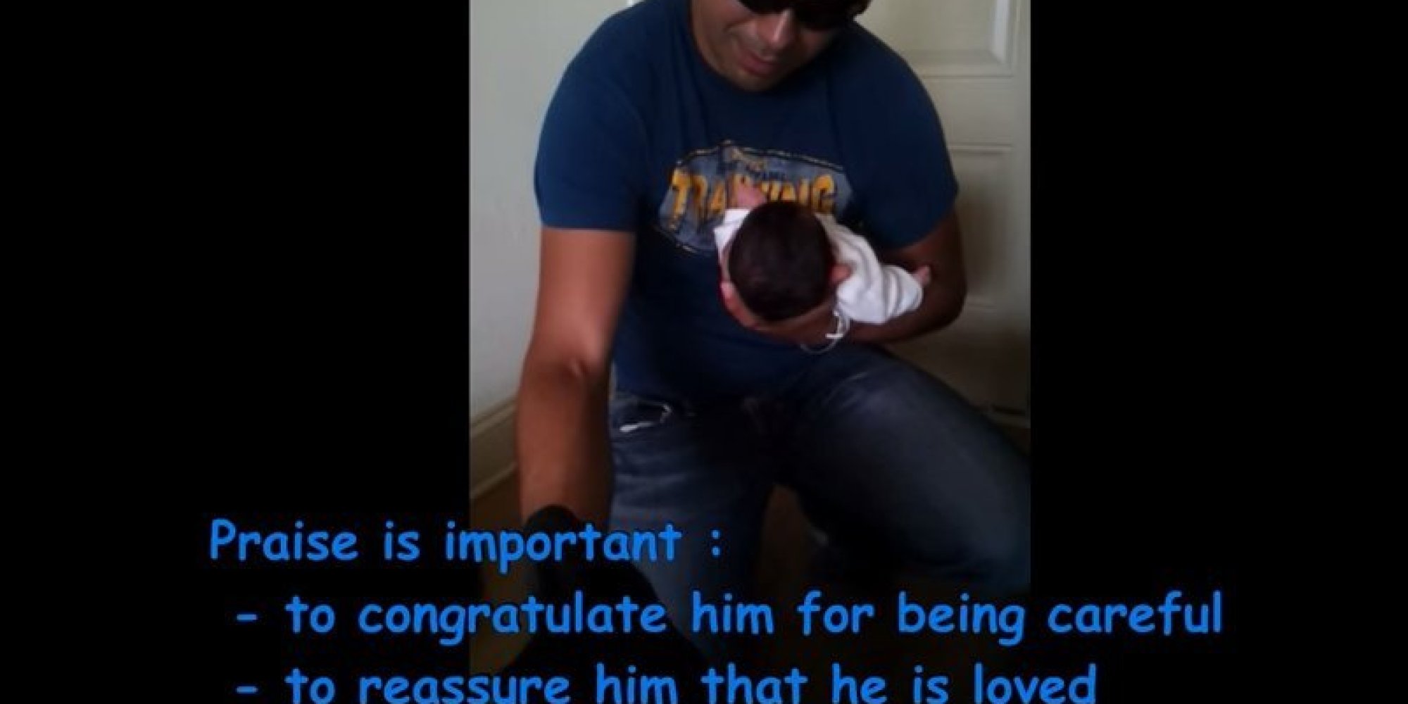 Parents Demonstrate How To Introduce A Dog To A Newborn Baby In Home