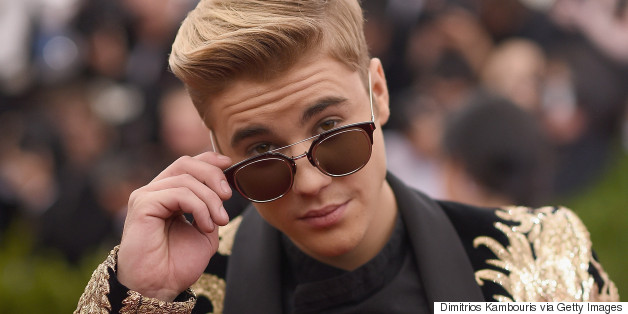 Justin Bieber Plants A Kiss On His Bodyguard But Wants You To Know He's 'Not Gay'