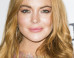 Lindsay Lohan Soaks Up The Sun In A White Bikini