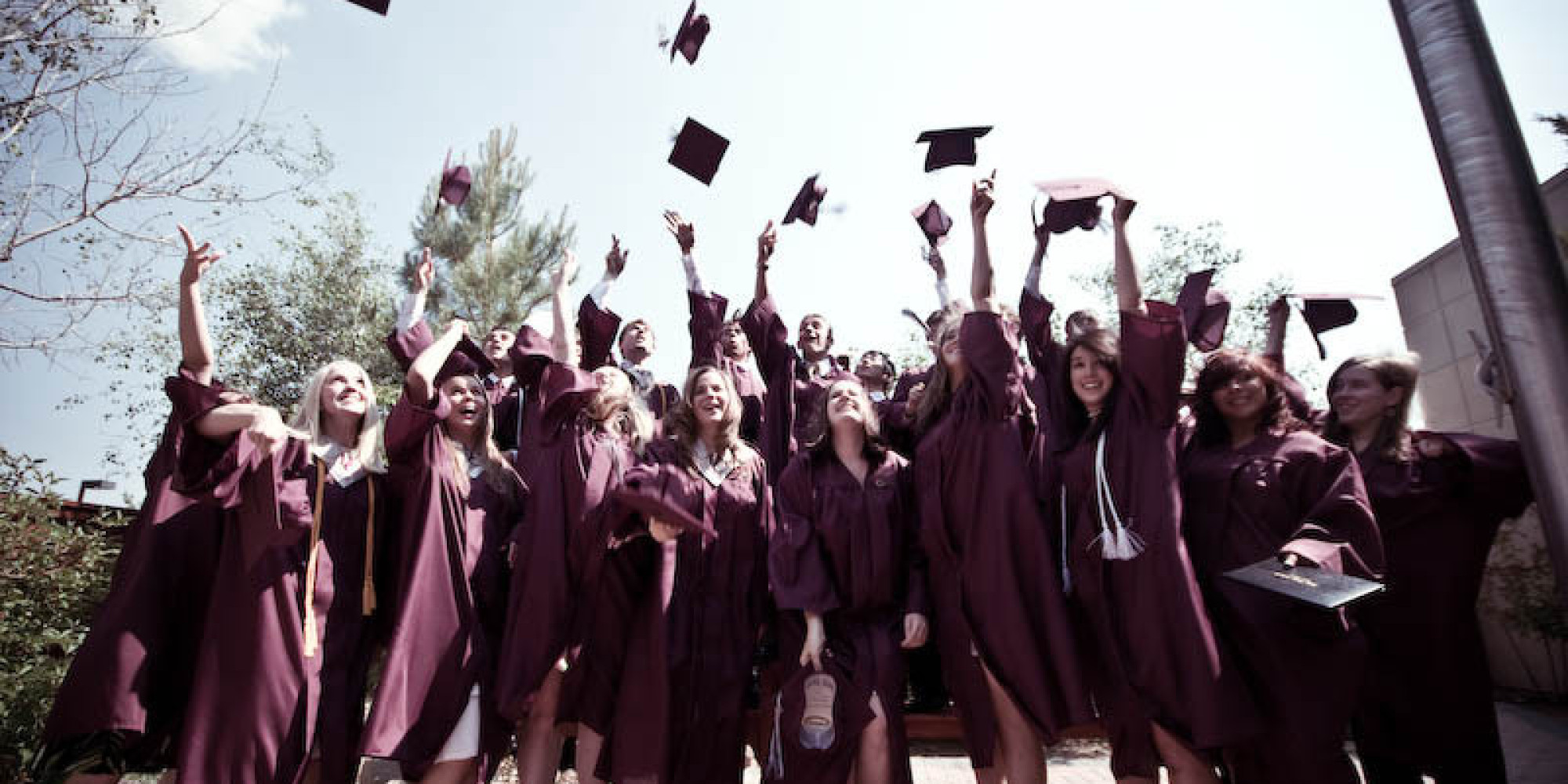 graduation caps on people