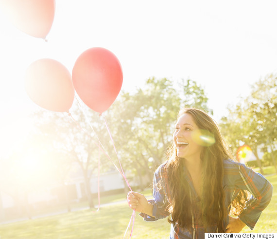 woman happy balloons