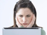 Woman Looking Sad at Her Computer