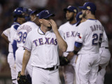 Matt Harrison #54 of the Texas Rangers is removed from the game by manager Ron Washington in the fourth inning during Game Three of the MLB World Series against the St. Louis Cardinals at Rangers Ballpark in Arlington on October 22, 2011 in Arlington, Texas.