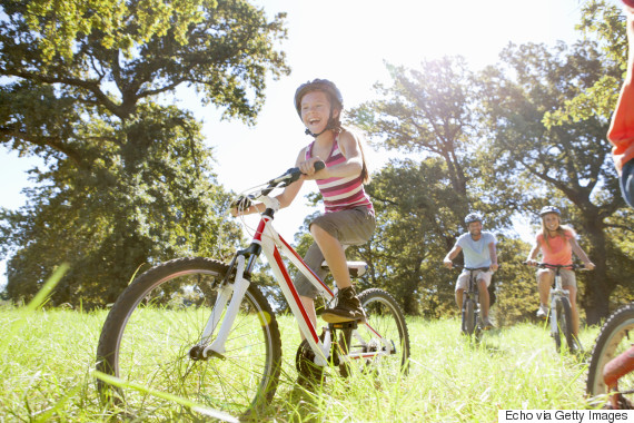 child bicycle grass spring