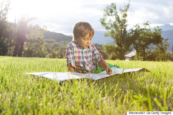 child with map outside