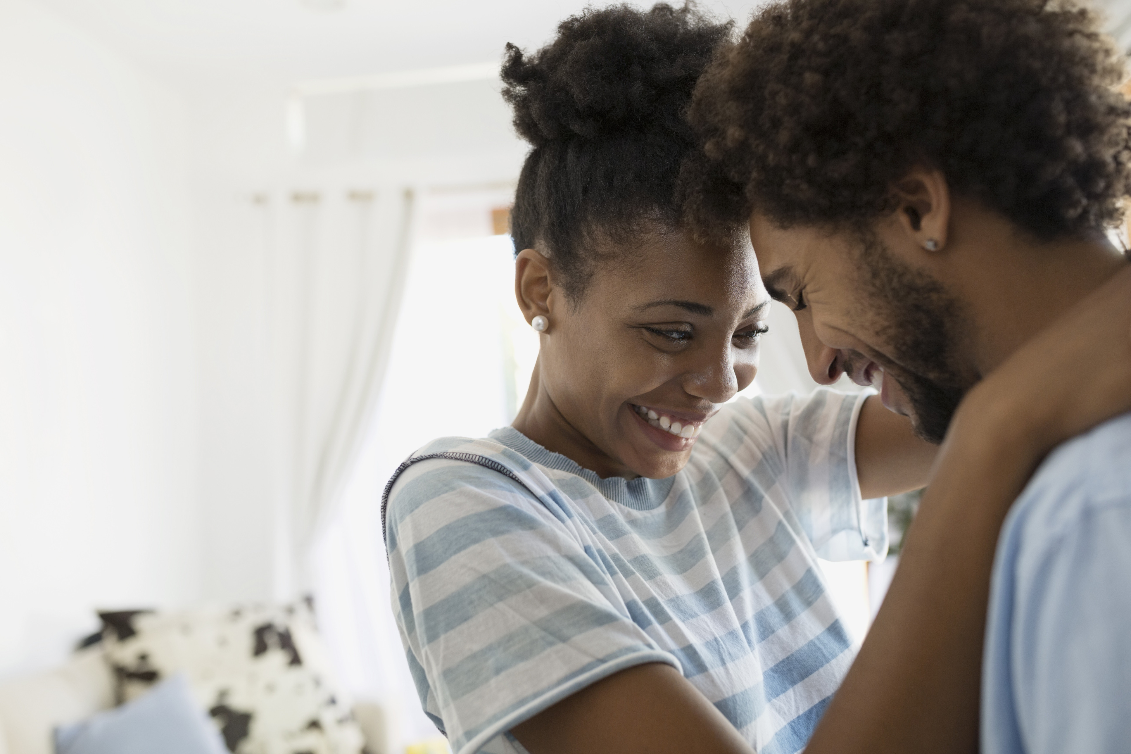 man and woman hugging