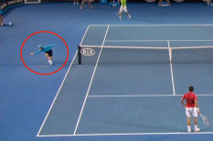 Ball boy making a catch