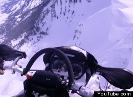 WATCH: Snowmobiler Almost Falls Down A Mountain