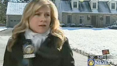 WXPI reporter Courtney Brennan in front of Jerry Sandusky's home in Penn.