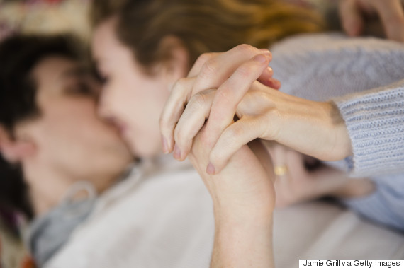 couple cuddling in bed