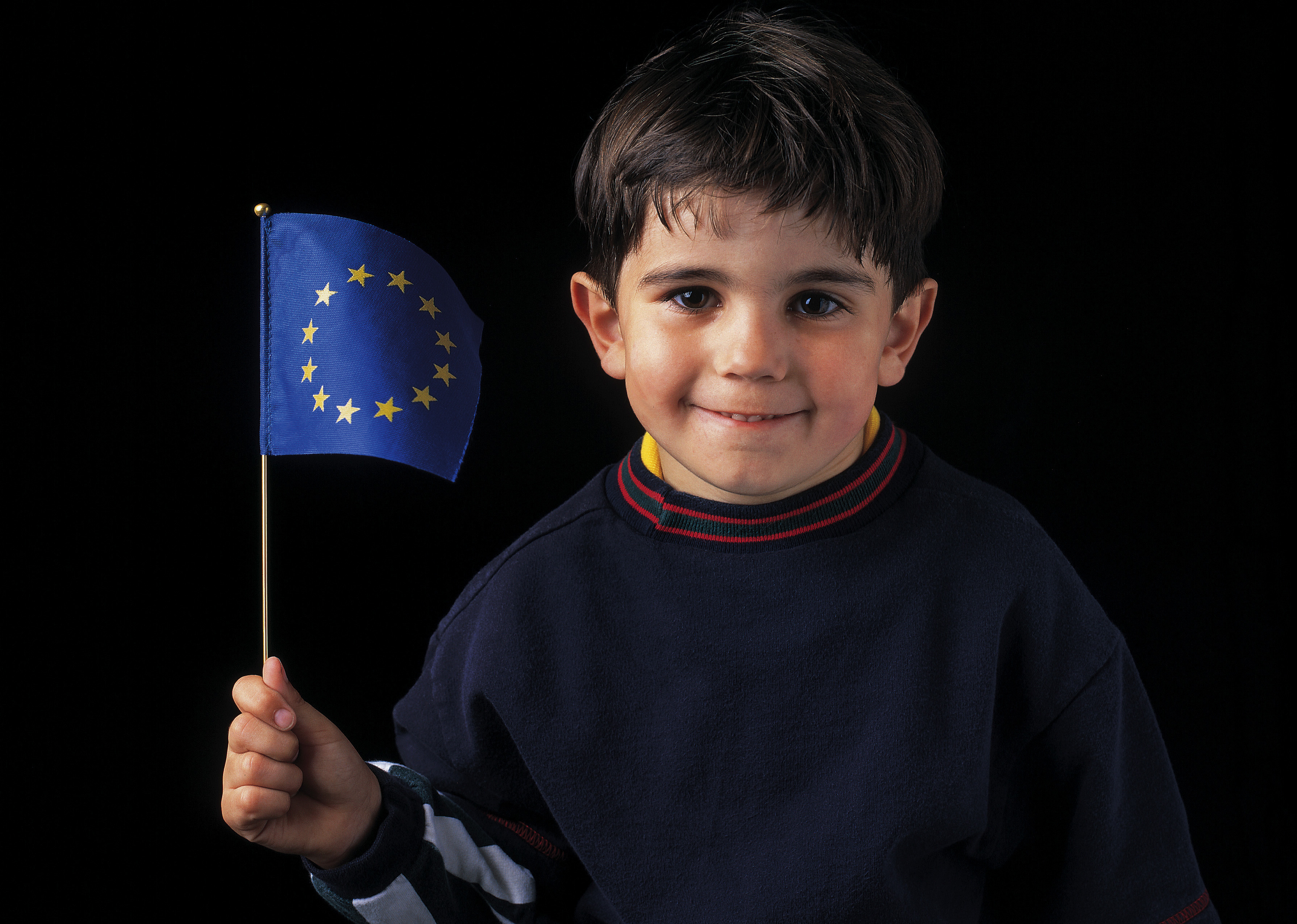 child holding flag eu