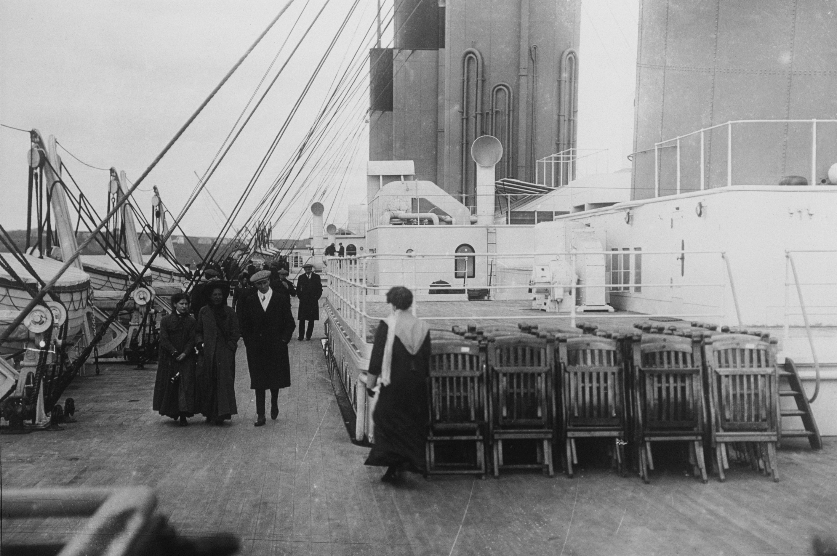 titanic passengers stroll past neatly arranged dec