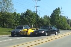 Lamborgini stick in between two other cars
