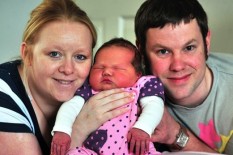 Baby girl with her parents