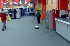Woman using vacuum cleaner