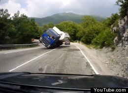 WATCH: Truck Tips Over, Slides Headlong Into Oncoming Car