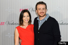 Emily Blunt Makes A Splash In Orange-Red Dress For Hamburg Photo Call