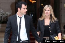 Jen & Justin Look Sharp In Suits On Paris Holiday