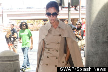 Victoria Beckham Does Airport Chic In Caped Trench Coat