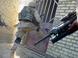 Soldiers entering an insurgent house in Iraq