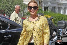 Kylie Minogue Shows Off Chic Street Style, Wears Medal-Inspired Metallics
