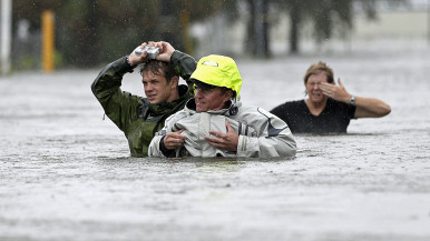 Hurricane Isaac victims wade through floodwaters in New Orleans