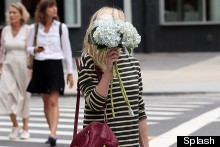 Kirsten Dunst Dresses As A Bee, Hides Behind Some Flowers
