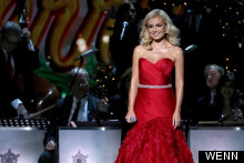 Scarlet Woman: Katherine Jenkins Gets Into Festive Spirit As She Performs At Christmas Bash