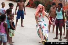Ball Skills: Lady Gaga Dons A Dress And Pink Wig To Play Footie With Rio Locals
