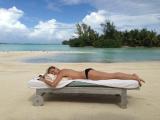 Heidi Klum Posts Topless Sunbathing Pic As...