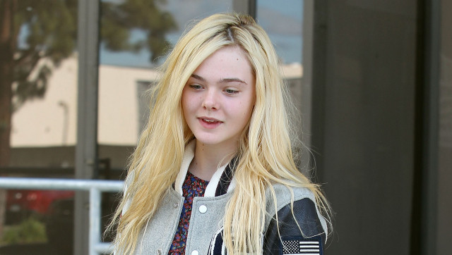 Elle Fanning Tries Out The Varsity Trend Photos 9948