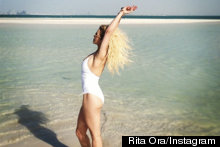 Life's A Beach For Rita Ora As She Strikes A Pose In Revealing White Swimsuit