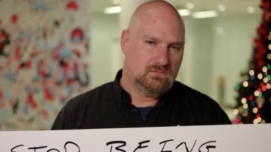 man holding sign