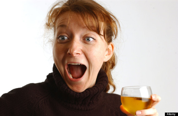 ginger woman drinking wine