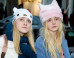 PHOTOS: The Fanning Sisters Wear The BEST Hats In South Korea