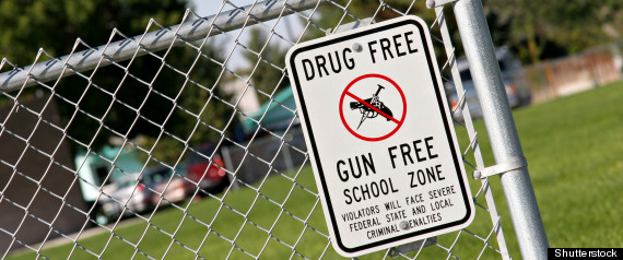 School fence with Drug Free Gun Free sign