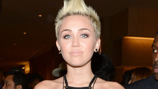 Miley Cyrus Flashes Sideboob Almost Pops Out Of Dress At Pre Grammy Party Photos