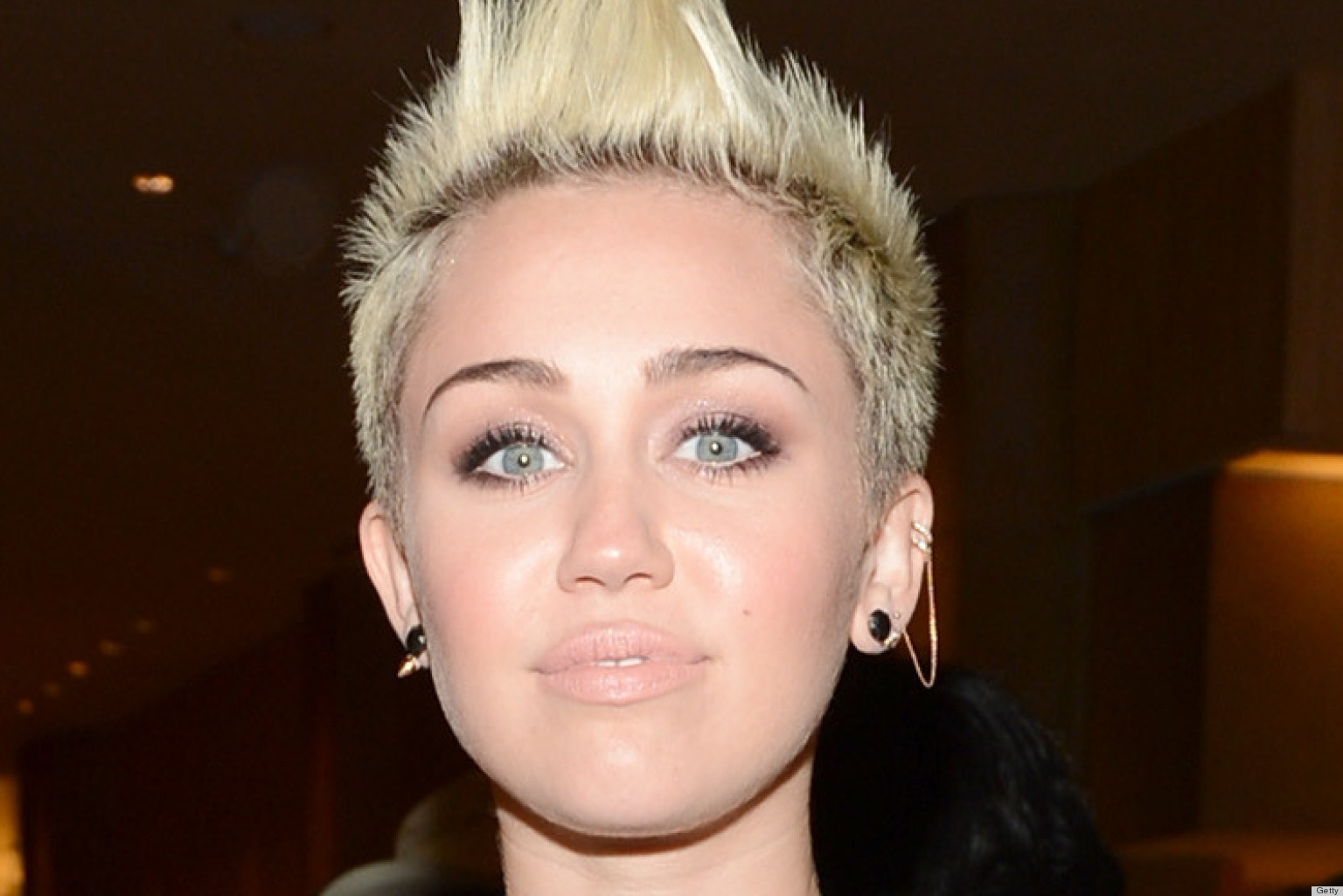 Miley Cyrus Flashes Sideboob Almost Pops Out Of Dress At Pre Grammy Party Photos 