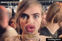 Pucker Up: Cara Delevingne Plays Backstage At New York Fashion Week