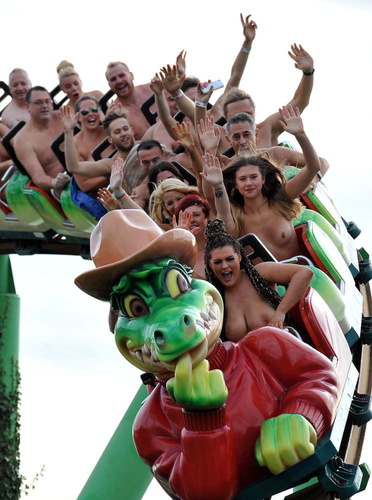Nick Ansell/PA Wire People take part in a naked roller coaster ride record ...