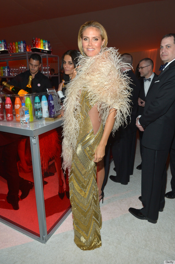 Heidi Klum flashes daring cleavage in low-cut dress at Elton