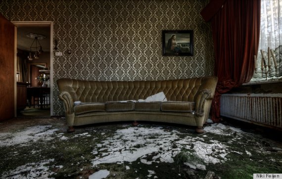 Abandoned Mansion Features Upholstered Furniture Pictures Still Hanging On Walls Photos