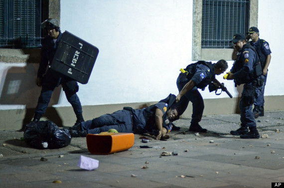 protesters beat police brazil