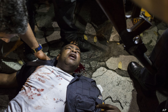 protesters beat police brazil